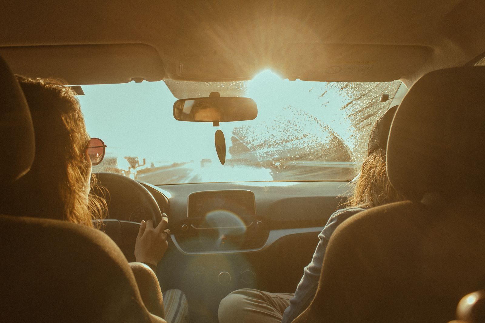 Harsh sun glaring through a car windshield